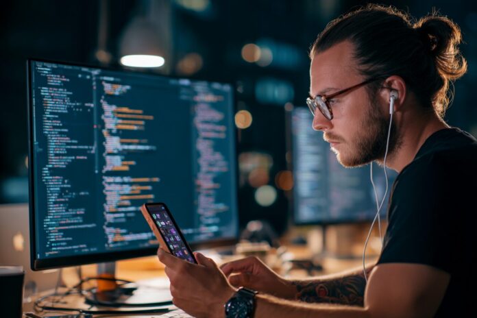 A modern developer working on both web and mobile projects highlighting Kotlin’s cross-platform capabilities.