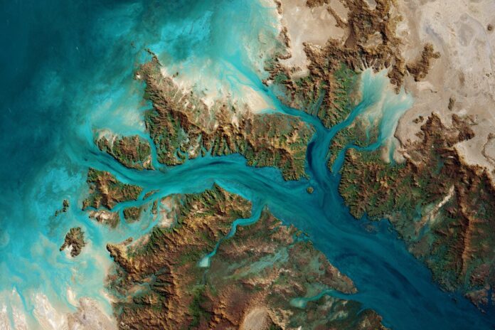 A satellite view showing the turquoise, sediment-laden waters of the Buccaneer Archipelago, Western Australia, as seen from Landsat 9.