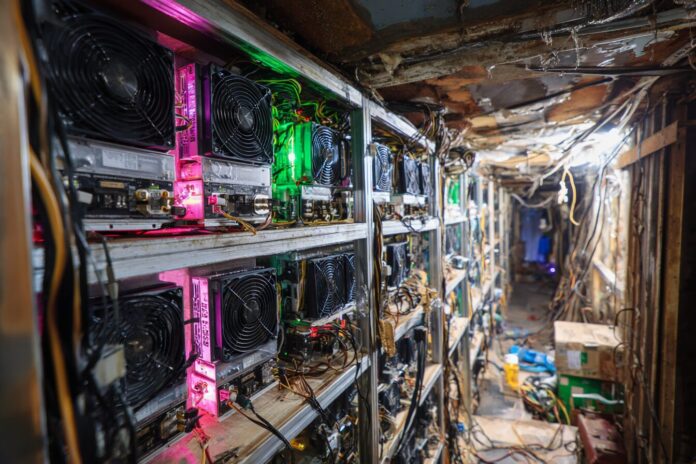 Hong Kong police inspect hidden bitcoin mining rigs found in care home ceiling.