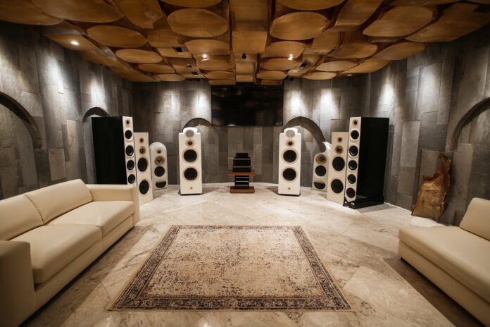 Modern home theater with multiple subwoofers positioned around the room.