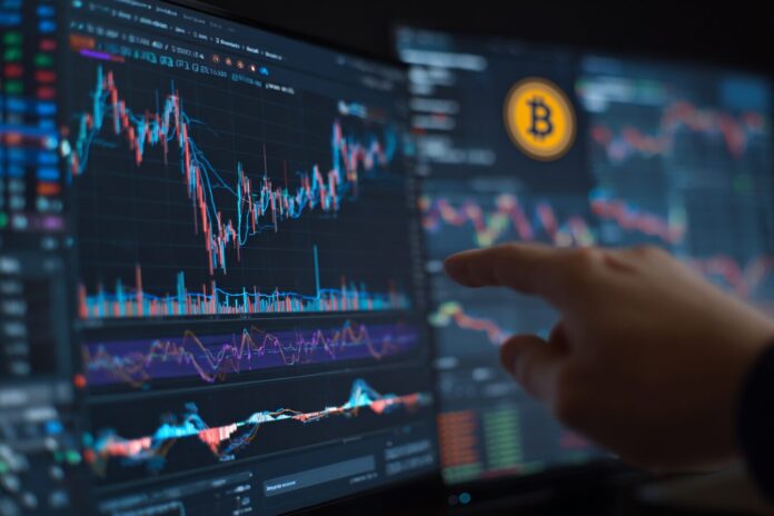 A serious analyst points at statistical charts while Bitcoin price graphs display on a monitor.