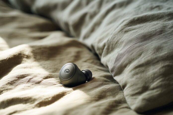 Anker Soundcore Sleep A30 earbuds resting on a pillow.