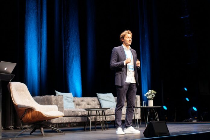 Anton Osika speaking on stage at a tech conference