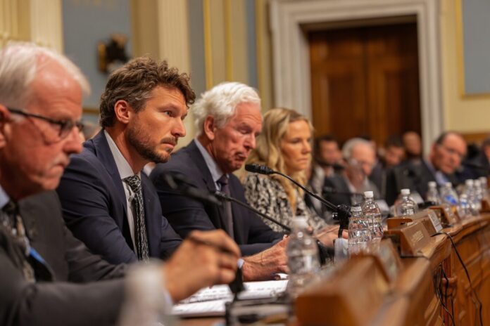 Lawmakers at a hearing discussing AI companion regulations.