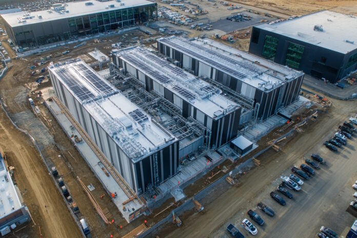 Aerial view of a cutting-edge OpenAI data center under construction with massive server arrays.