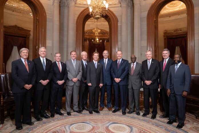 12 Senators standing together after unveiling digital asset regulation framework.