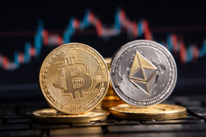 A physical Bitcoin coin and Ethereum token pictured side by side against a background of fluctuating market charts.