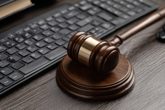 Gavel, legal documents, and computer keyboard symbolizing the intersection of law and digital identity